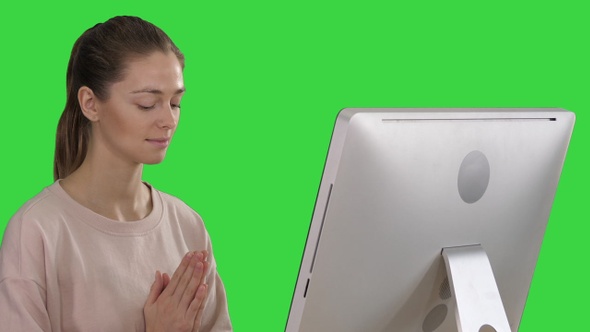 Attractive woman in a chair at the table with computer