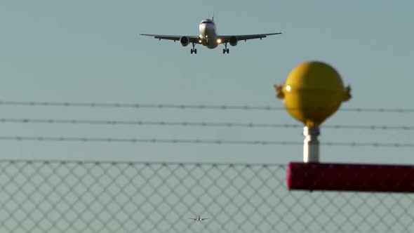 Modern Airplane Airliner Landing at Airport