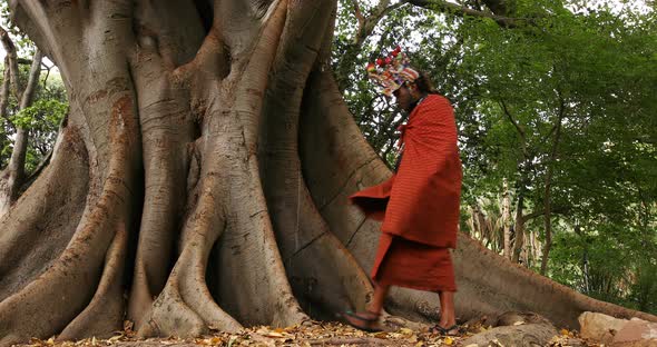 Tribal man relaxing under a tree 