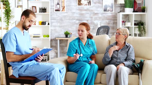 Male Assistant Taking Notes on Clipboard alt