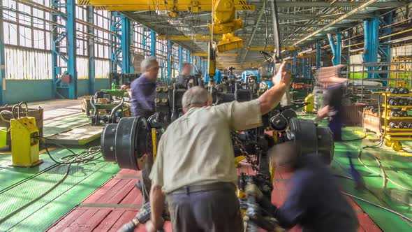 Conveyor Assembly Stage the Body of Tractor at Big Industrial Factory Timelapse