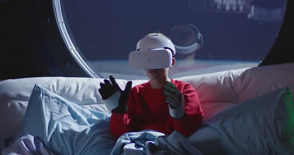 Boy Using VR Technology in a Spaceship