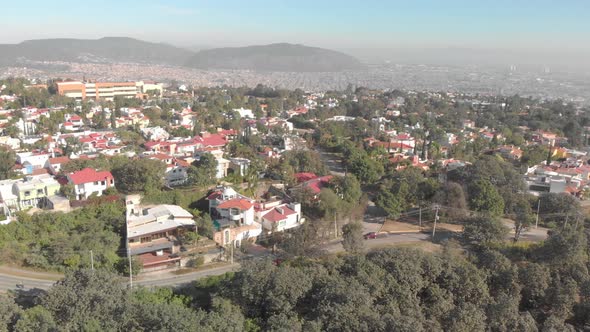 drone shot , zoom in on a house in a residential area