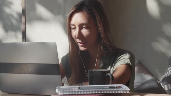 Woman Having Video Conference on Laptop