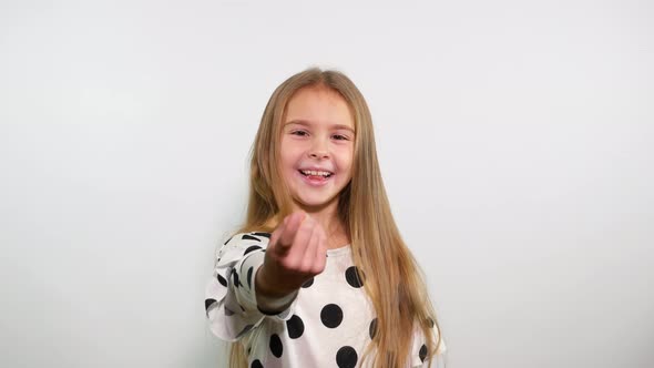 Playful Girl Waving to Come to Her Using One Finger as Gesture