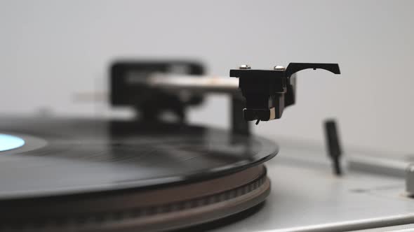 Close Up Of A Tone Arm And Spinning Vinyl Record And Its Start First Song