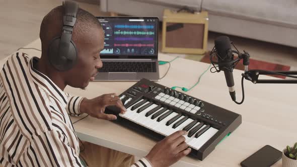 African Musician Working in Sound Design Home Studio