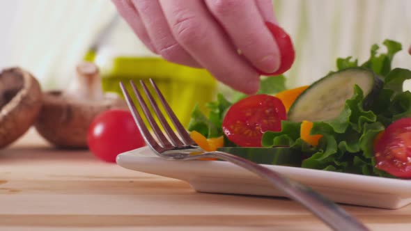 Making fresh healthy salad, closeup