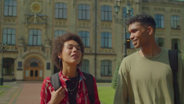 Portrait of Attractive Black Couple of Students Walking at University Campus