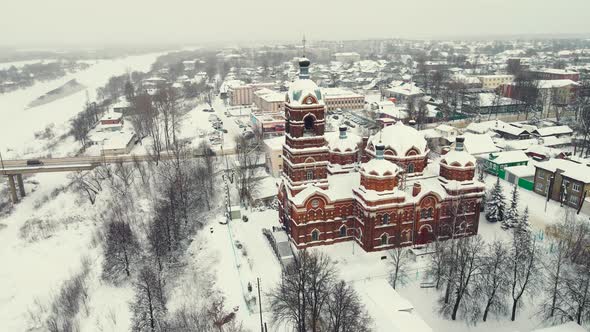 Beautiful Winter Landscape Aerial View a Town on the River Bank and a Church