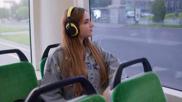 Young Woman Wearing Headphones Listening Music Funny Relax Dancing While Traveling By Bus to City