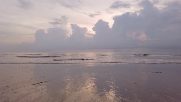 slow-motion natural sea wave water with foam on the sandy beauty white beach, summer beach seascape