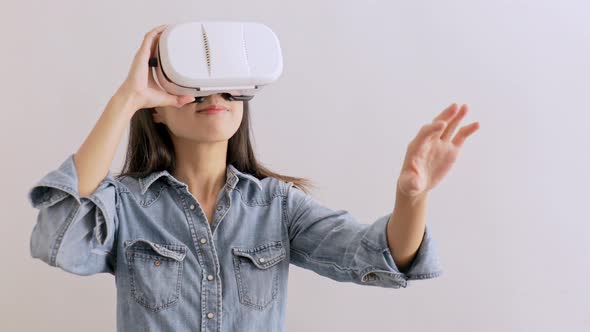 Woman looking though virtual reality device