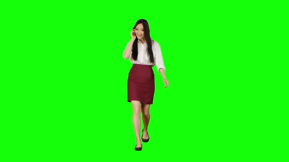Manager Girl Goes To Her Phone Rings and She Starts Talking. Green Screen