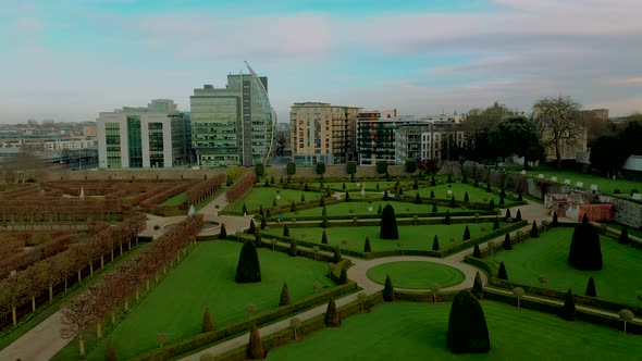 Drone view rising over public gardens in Dublin city