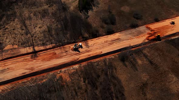 Truck with Sand and Construction Machinery Working During Building of New Highway Road in Europe