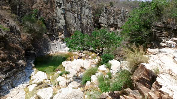 Stone border and waterfall cliff in Capitólio. Nature in Brazil.