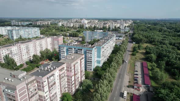 Aerial View MultiStorey Buildings Near Green Forest in Residential Area at City