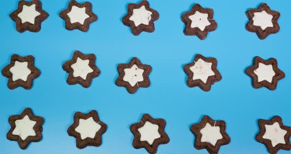 Stop Motion Animation Of Cookies From Stars, Baked Goods In Motion Animation On A Blue Background.