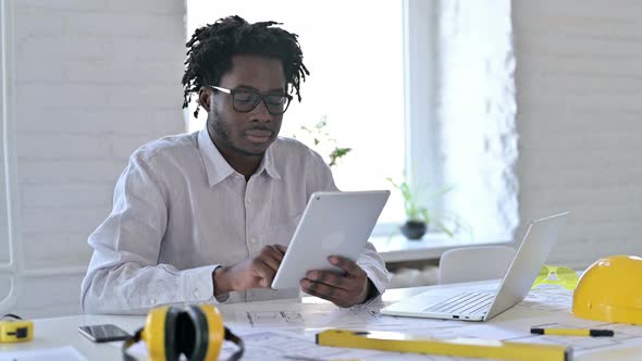 African Engineer Using Tablet