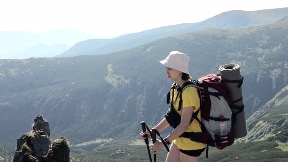 Woman wanderer on the top Shpitsy mountain in Carpathians. Travel sport lifestyle concept