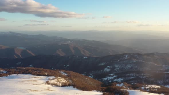 Aerial view at the mountain on a sunny winter day