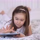 Cheerful Girl Using Tablet on Bed - VideoHive Item for Sale
