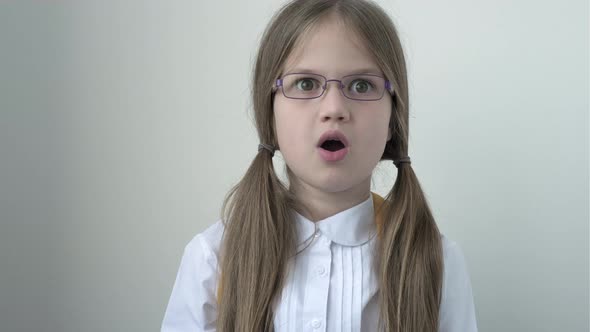 Surprised Schoolgirl with School Bag in White School Blouse and Glasses