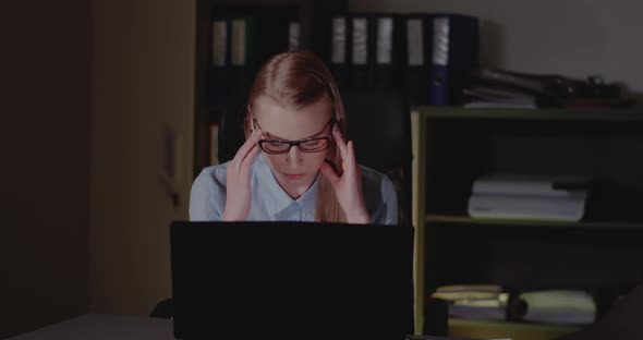 Businesswoman Working Late in Office