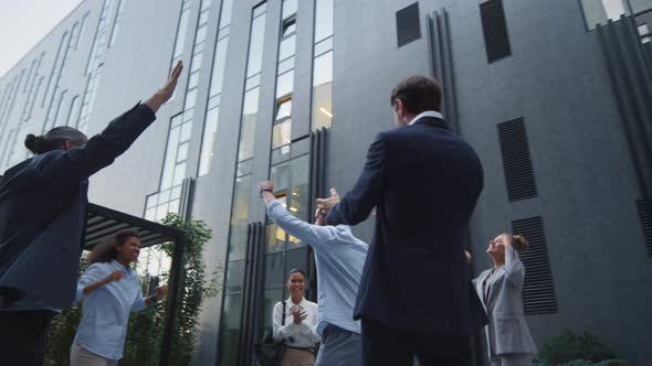 Happy Team Appreciate Employee Outside Office Building