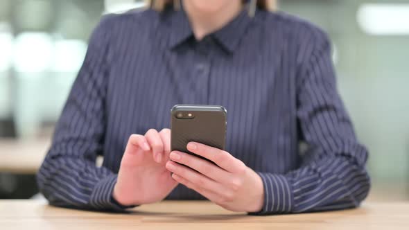 Close Up of Businesswoman Celebrating Success on Smartphone