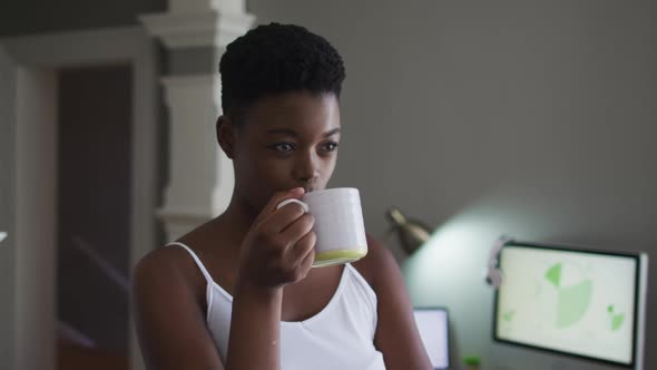 African american woman drinking coffee at home
