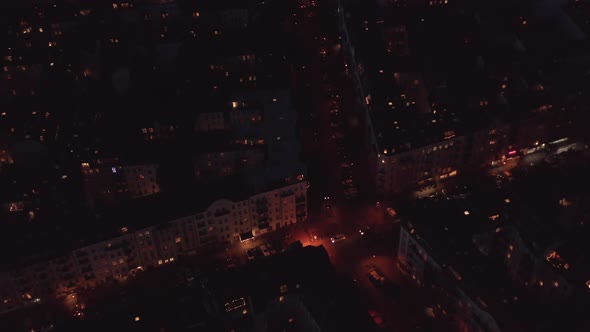 Aerial View of Evening Traffic in Streets of Urban Neighbourhood