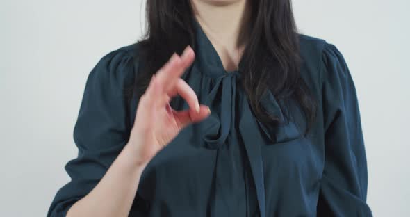 Woman giving the "OK" sign