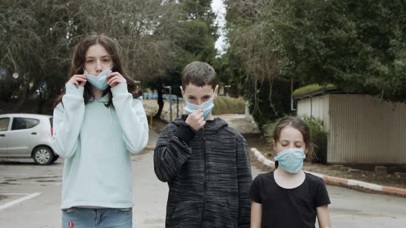 Coronavirus pandemic - kids wearing face masks to avoid contagion