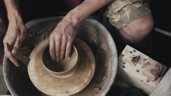 The Hands of a Potter Creating an Earthen Jar on the Circle Closeup Hands on Circle with Clay