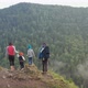 Young Parents with Three Children Climb To the Top of the Mountain and Enjoy the Beautiful View - VideoHive Item for Sale