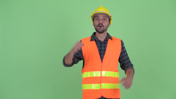 Happy Young Bearded Persian Man Construction Worker Getting Good News