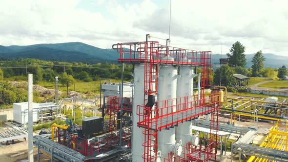 Aerial View Gas Station Operator Descends From the Top of the Station. Modern Gas Complex in the