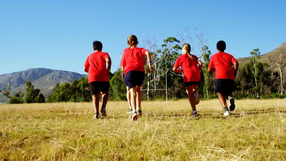 Trainer training kids in the boot camp