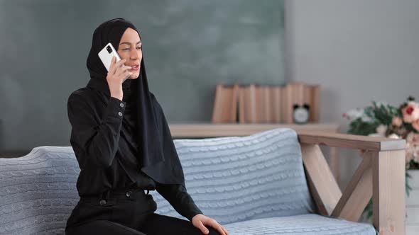 Adorable Arabic Woman Calling Smartphone Enjoying Friendly Communication