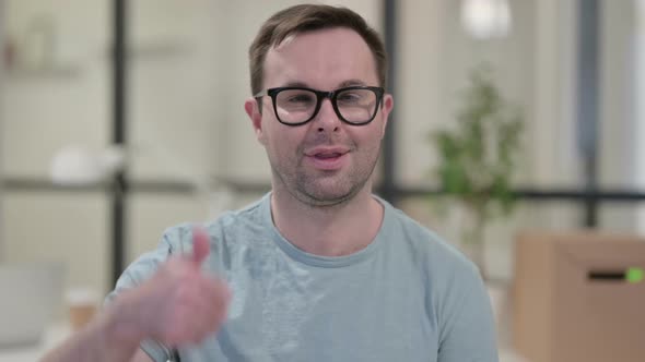 Portrait of Young Man Showing Thumbs Up Sign