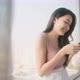 asian female casual relax in hotel,attractive casual cloth female sit on window bench - VideoHive Item for Sale