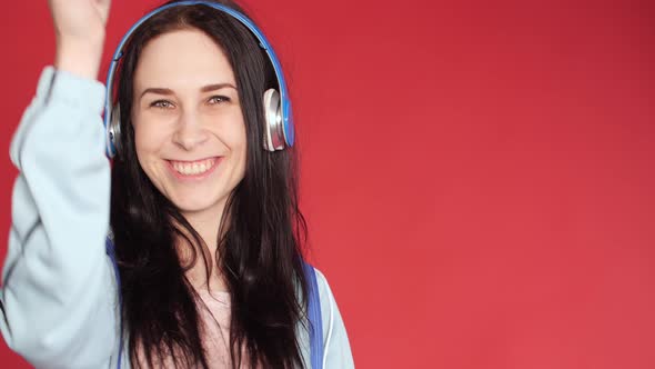 Happy Young Girl in Sportswear Listening To Music