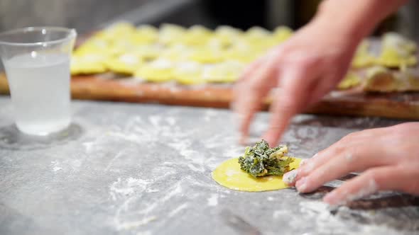 Preparing traditional italian ravioli. Homemade italian pasta.