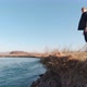 A Man Stands On The River Bank Slow Motion - VideoHive Item for Sale