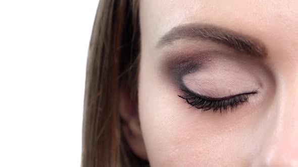 Woman Eye with Bright Makeup. Close Up. Slow Motion