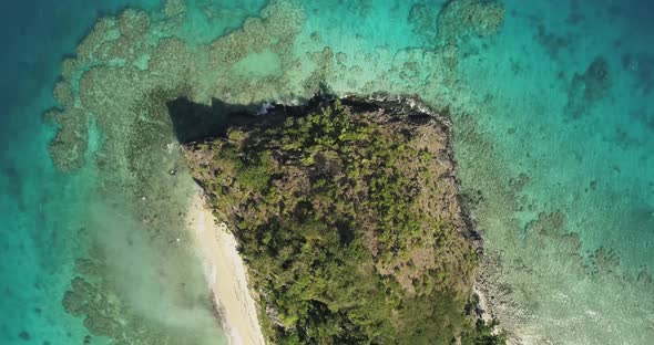 Aerial footage of ocean and land on an island in Tonga