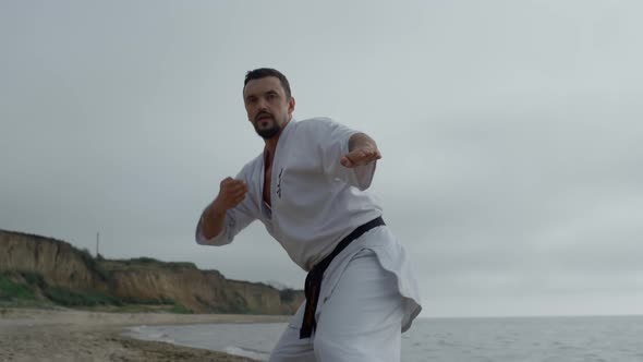 Karate Fighter Workout Fighting Exercises on Beach