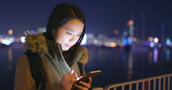 Young Woman Use of Smart Phone in City at Night